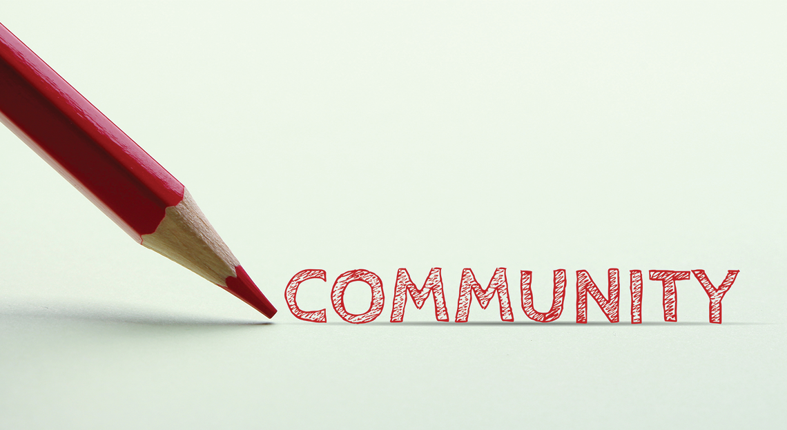 Μολύβι που γράφει τη λέξη Community